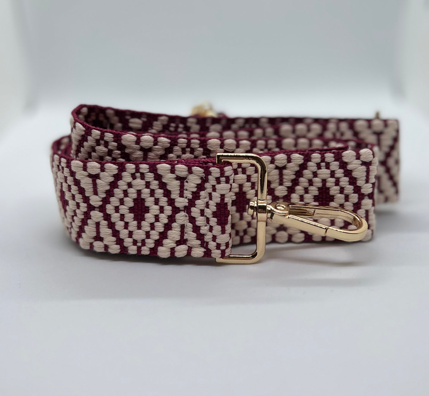 Wine and white woven diamond strap with gold hardware