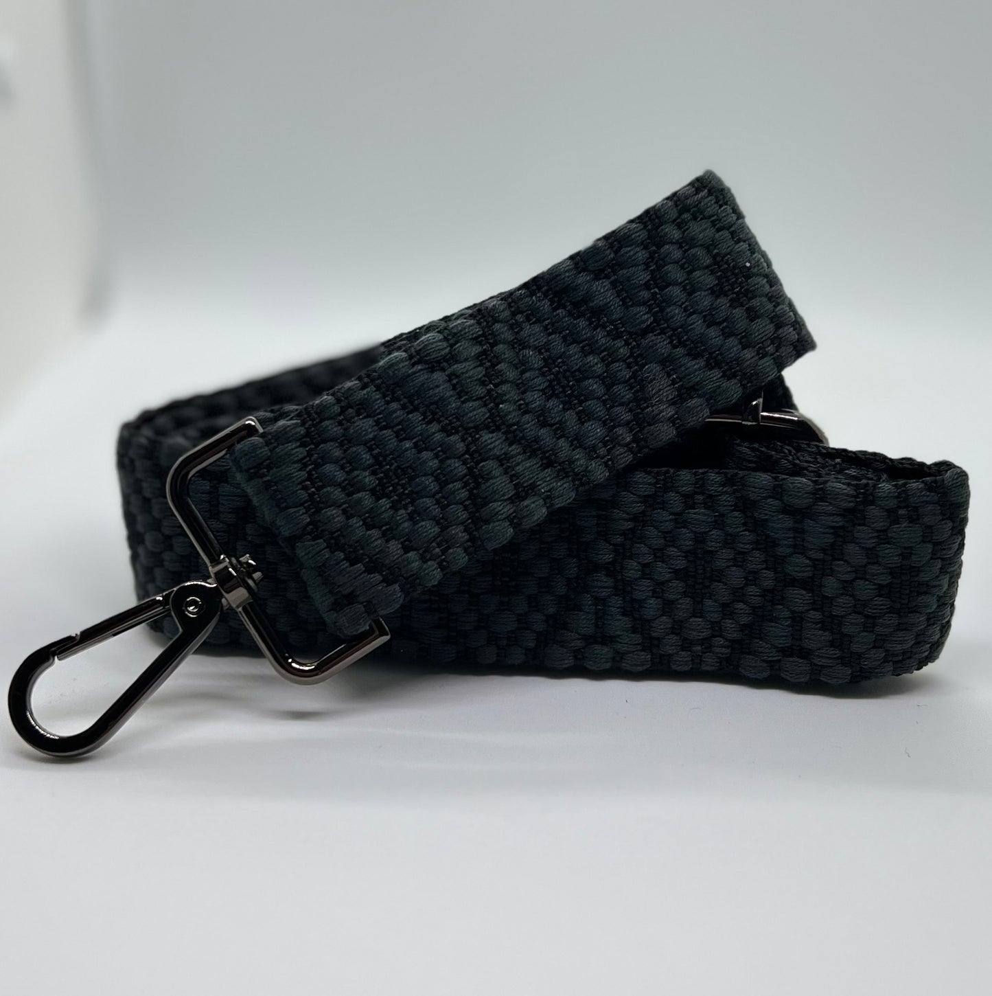 Gray and black woven diamond strap with gun metal hardware