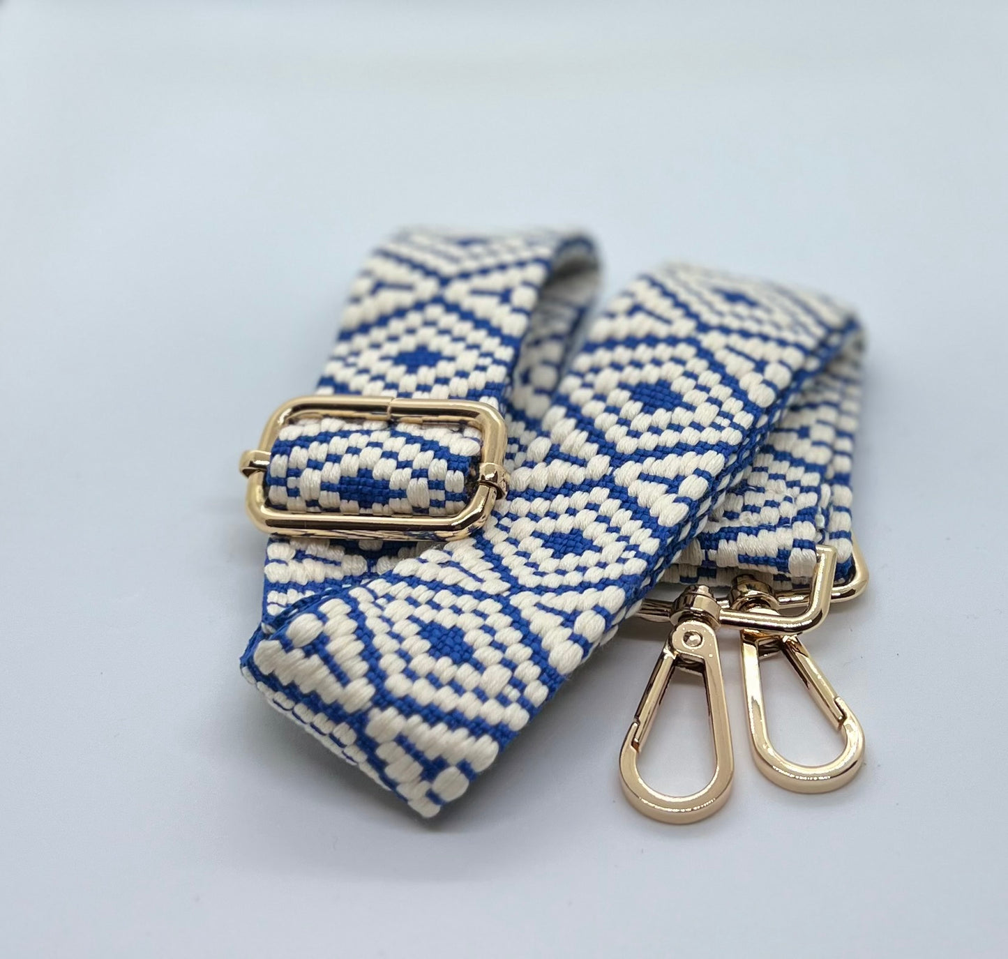 Blue and white woven diamond strap with gold hardware
